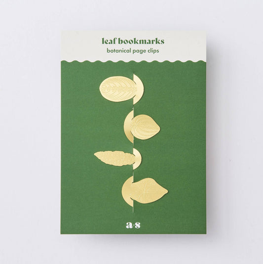 Packaging of leaf bookmarks with gold leaf designs on a green background