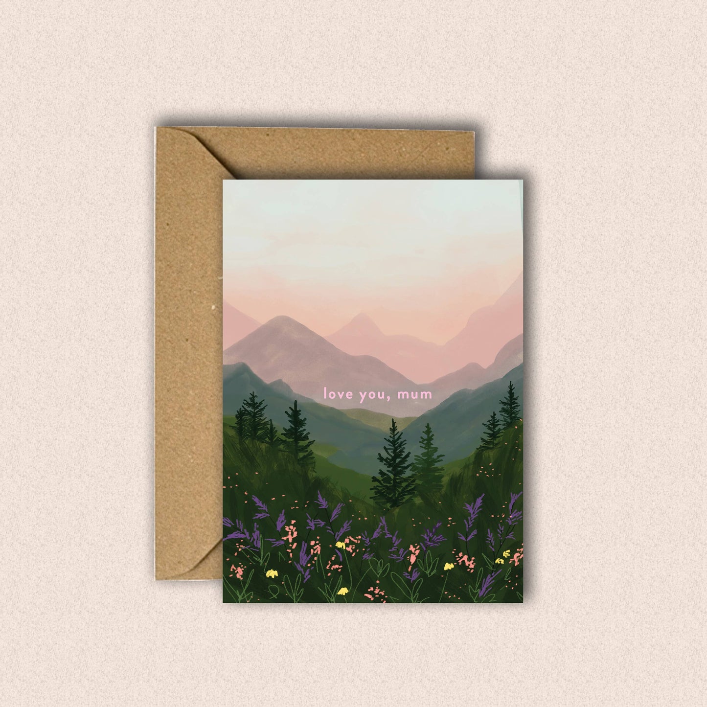 Greeting card with mountain and forest design and 'love you, mum' text on a beige background