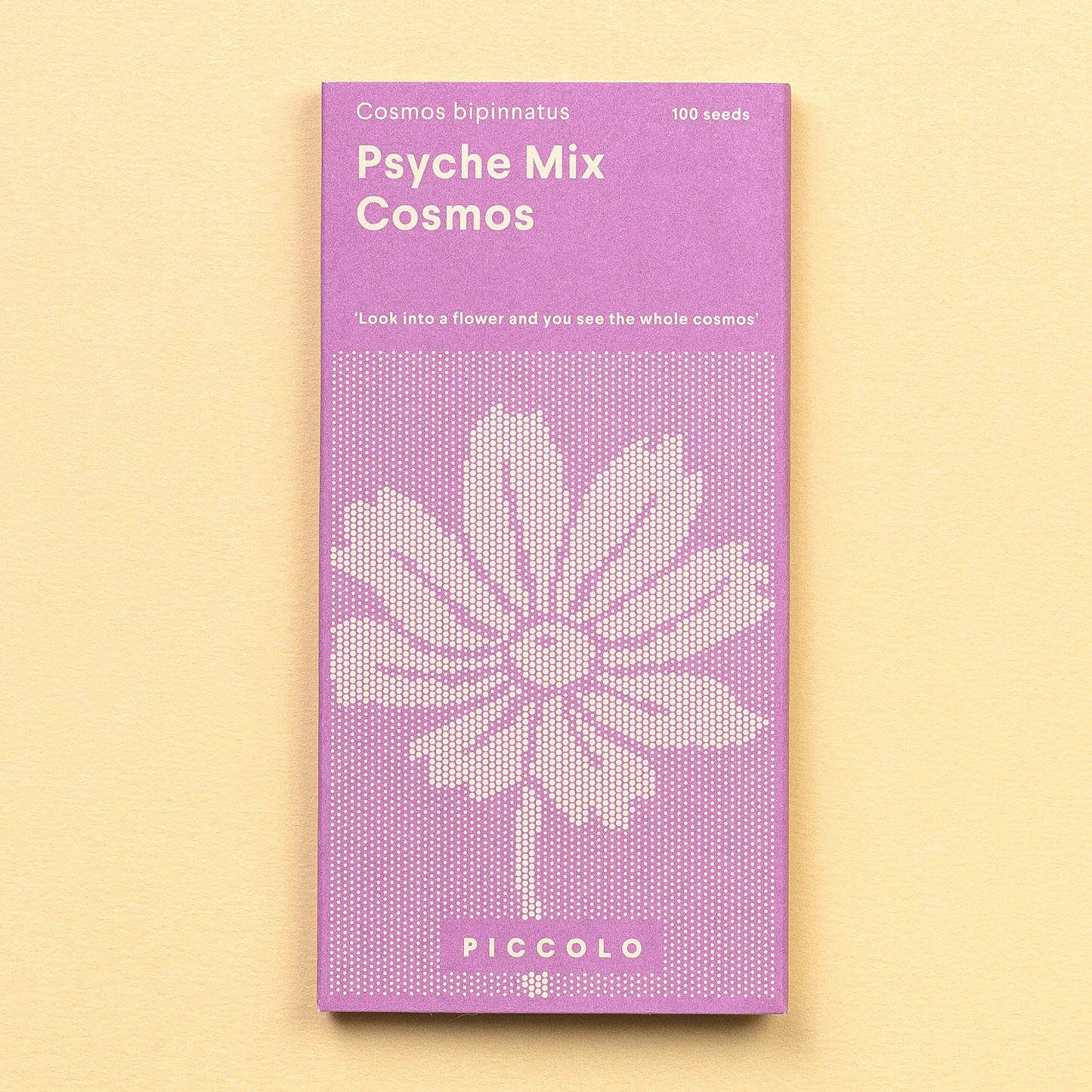 Purple packet of Piccolo Psyche Mix Cosmos seeds on a beige background