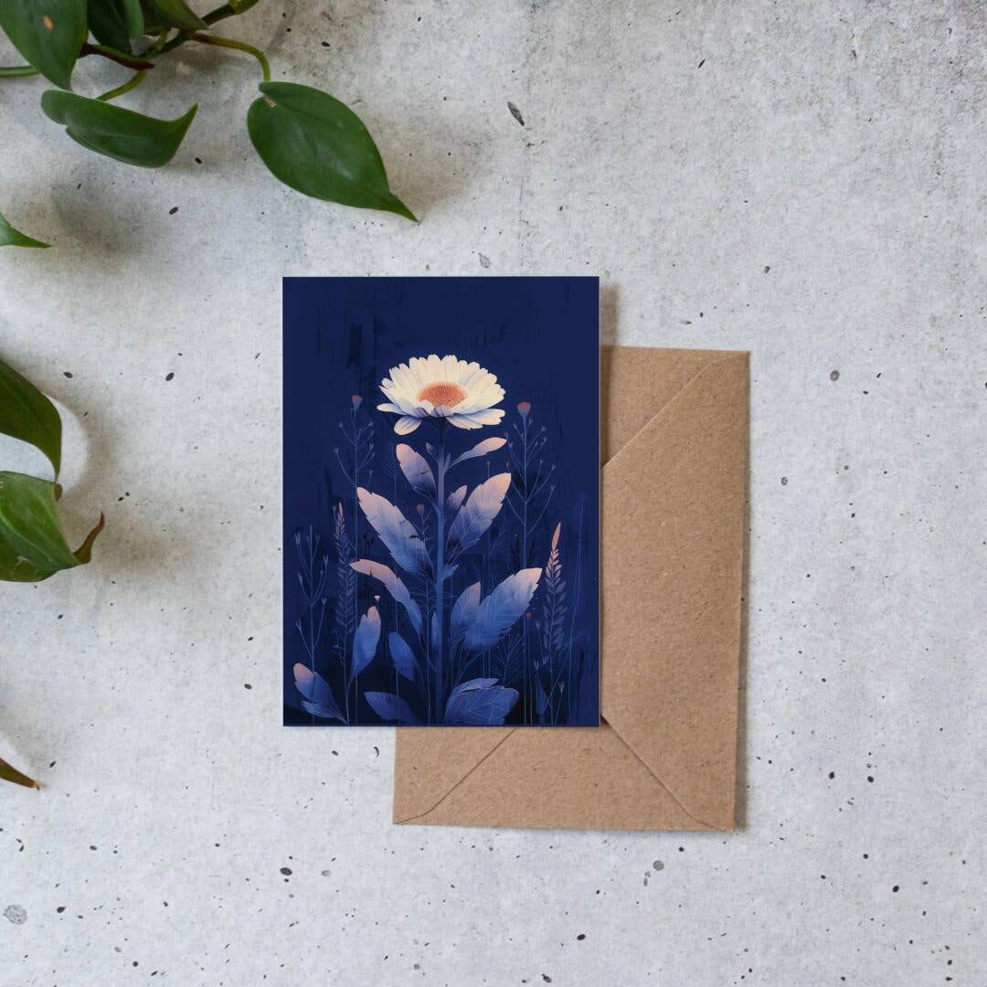 Greeting card with floral design on a textured surface with a brown envelope.
