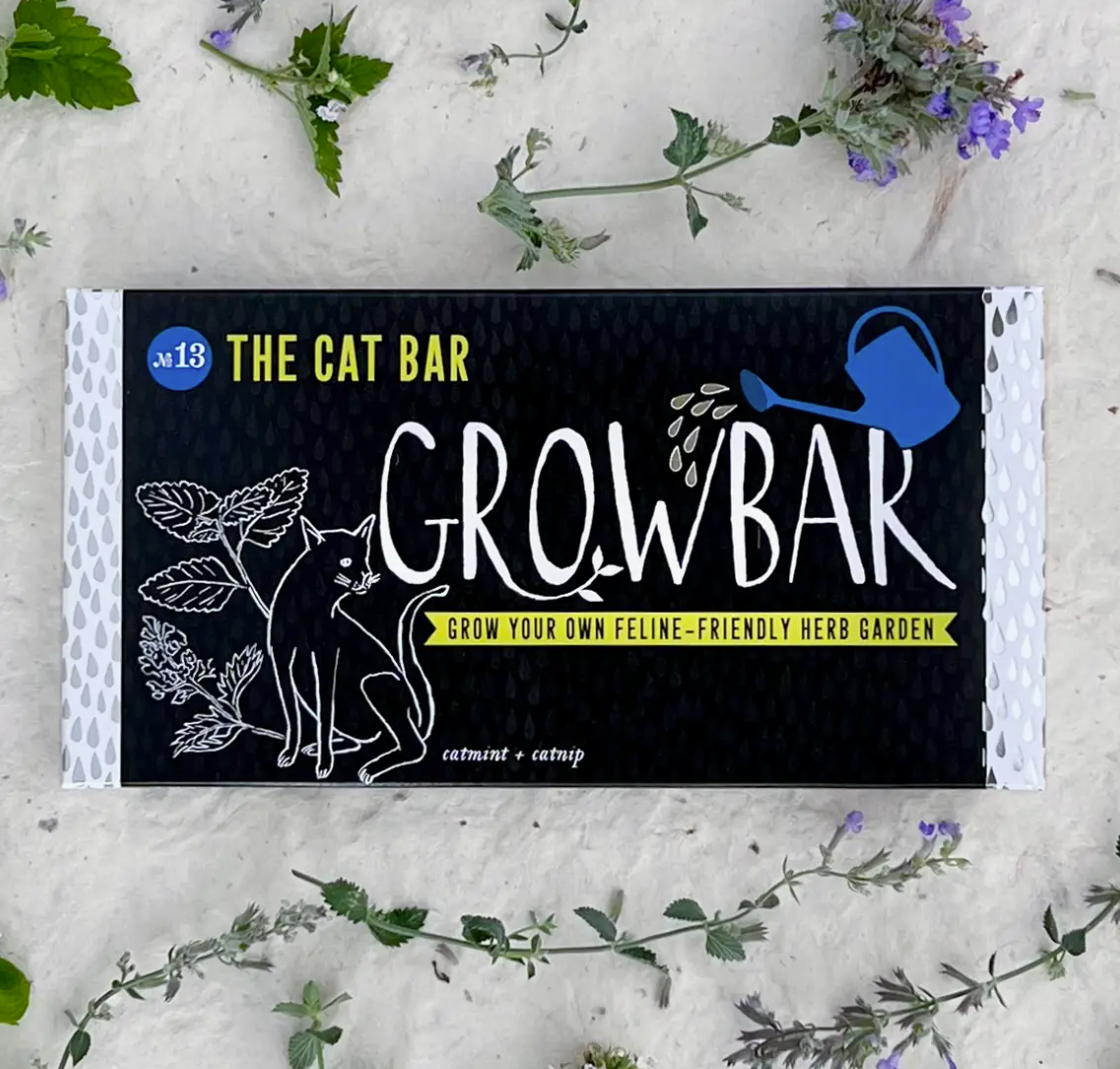 Grow Bar packaging for a feline-friendly herb garden with cat illustrations on a textured surface.