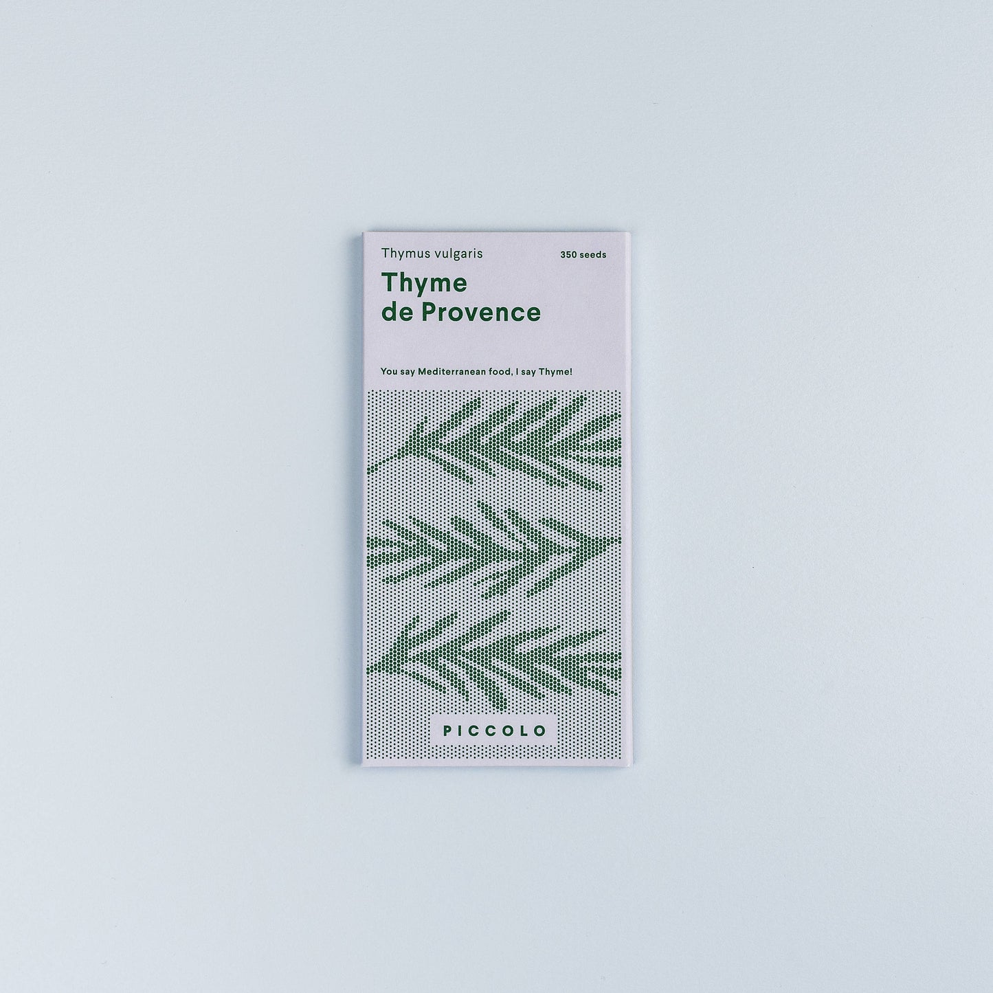 Packaging of Thyme de Provence with green leaf pattern on a light gray background