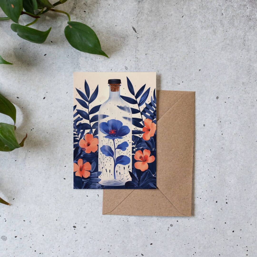 Greeting card with floral design and envelope on a textured surface