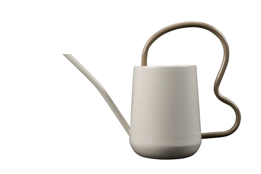 White watering can with a beige handle on a white background
