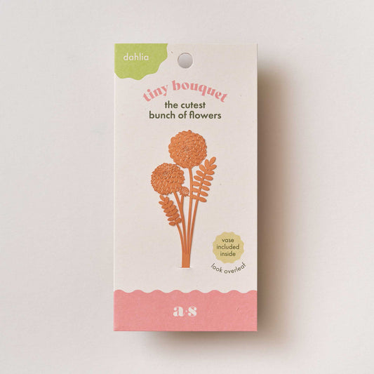 Cardboard packaging for a floral product with decorative elements on a light background