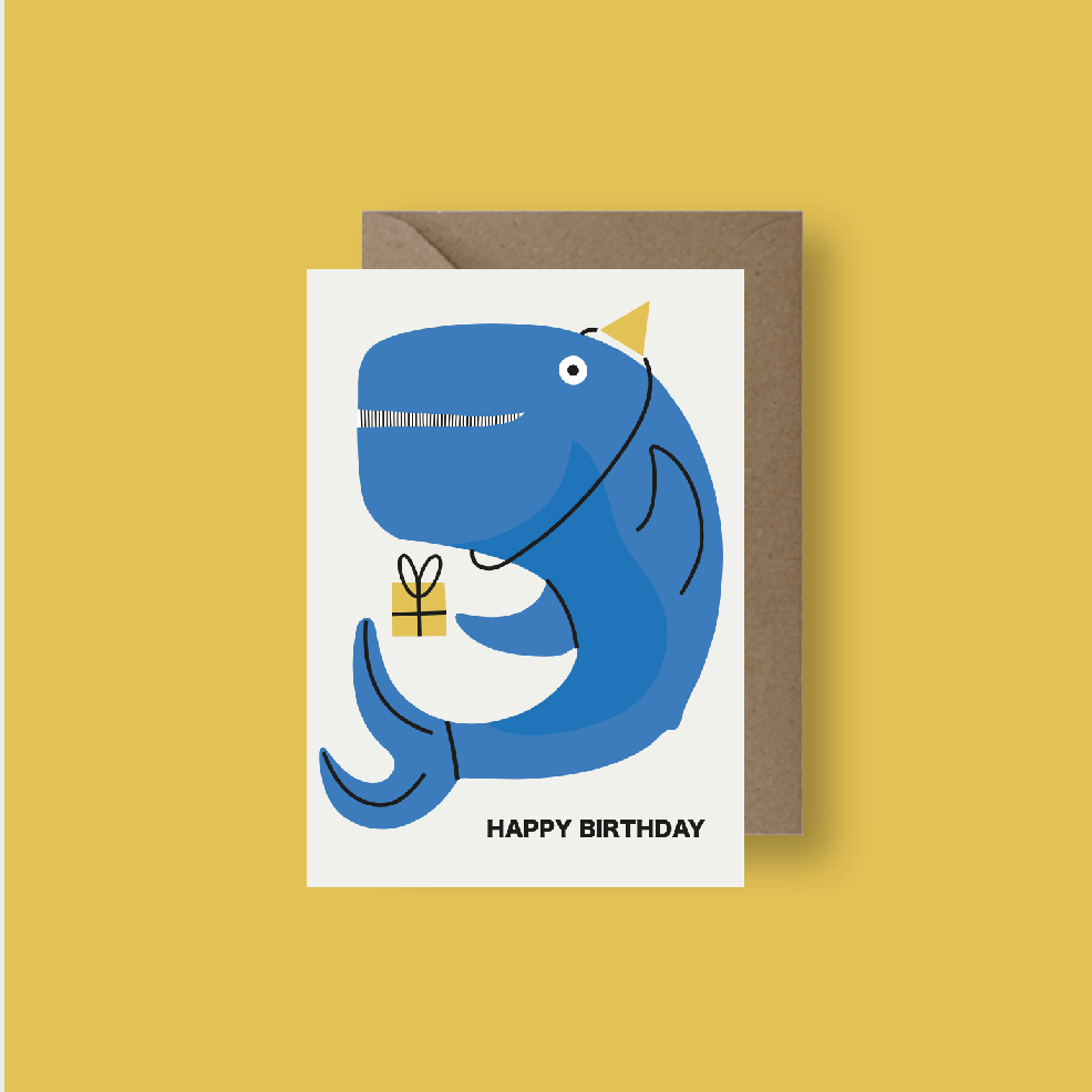 Birthday card with a blue whale holding a gift on a yellow background