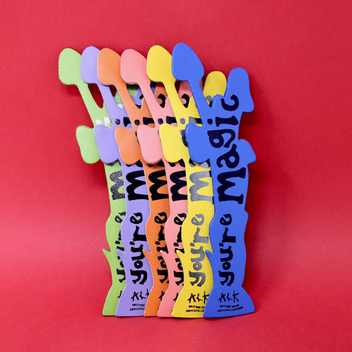 Colorful wooden cutouts with 'You're Magic' text on a red background