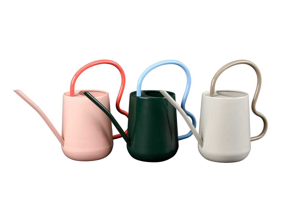 Set of four colorful watering cans on a white background