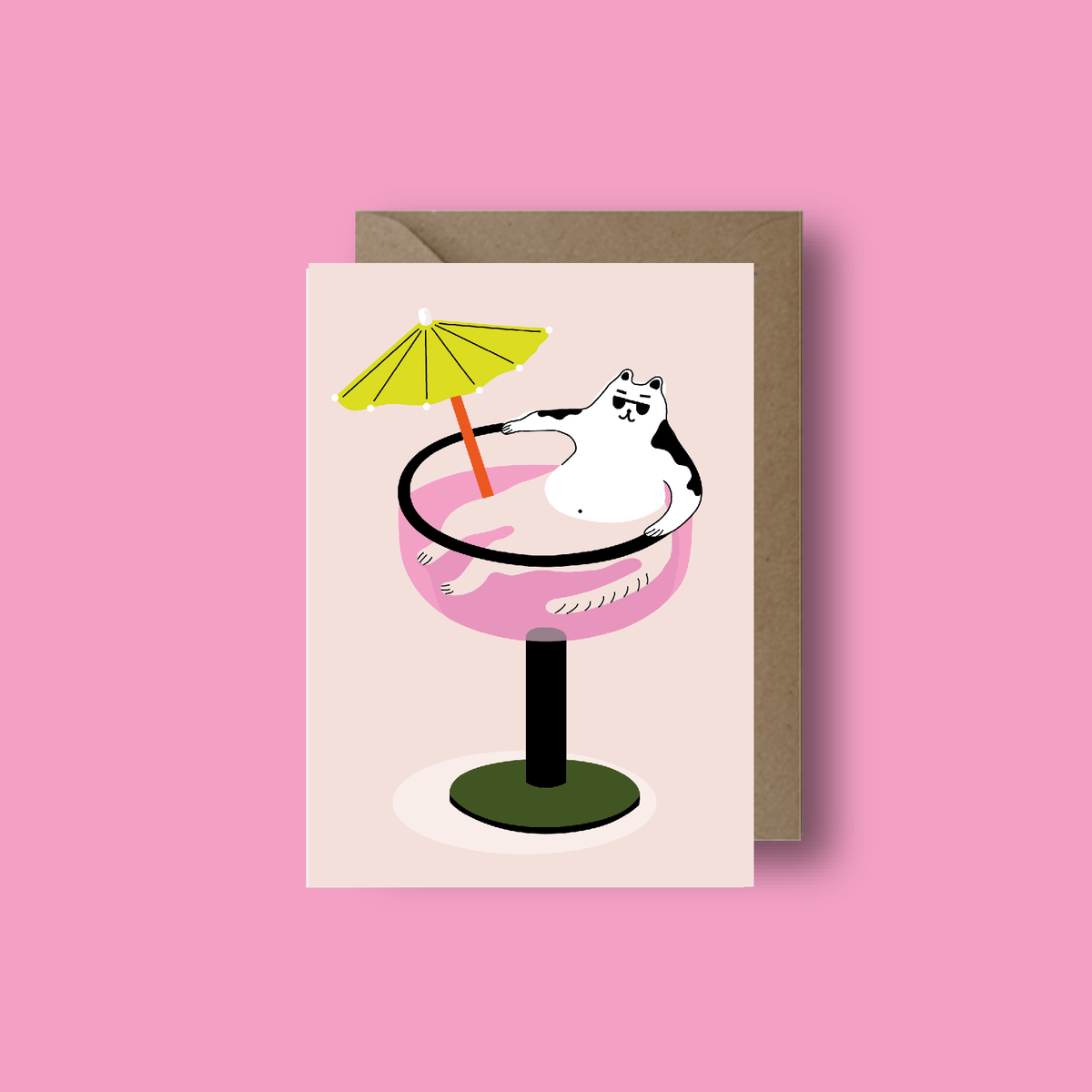 Greeting card with a cat in a pink cocktail glass on a pink background