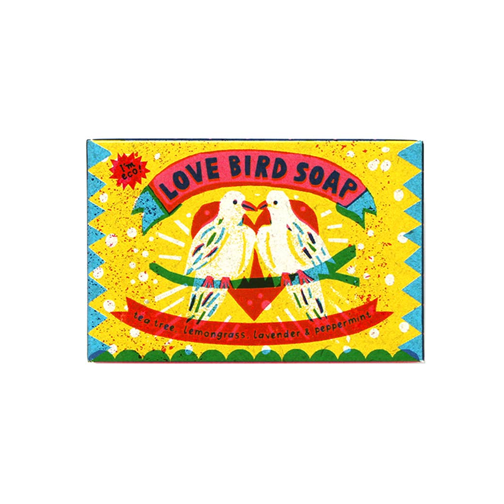 Colorful packaging of 'I Love Bird Soap' with two birds holding hands on a yellow background.