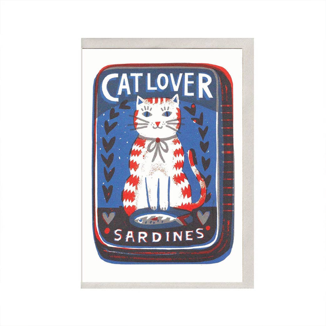 Framed artwork with a cat illustration and 'Cat Lover Sardines' text on a blue background.