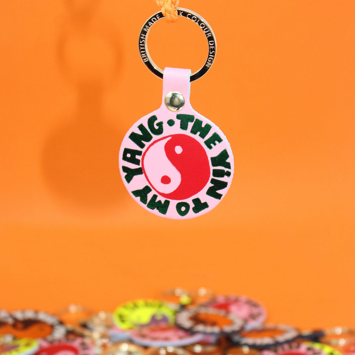 Keychain with 'Yin to my Yang' design on an orange background