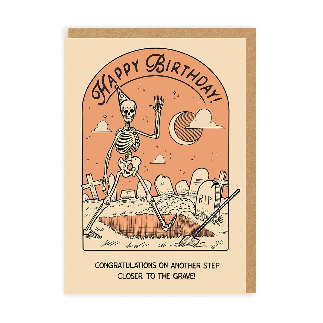 Birthday card with skeleton design and humorous text on a beige background