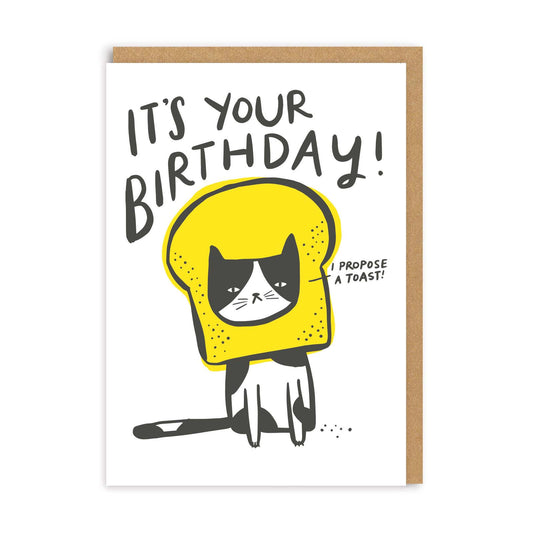 Birthday card with a cat in a yellow helmet and toast design, featuring text 'It's your birthday! I propose a toast!'.