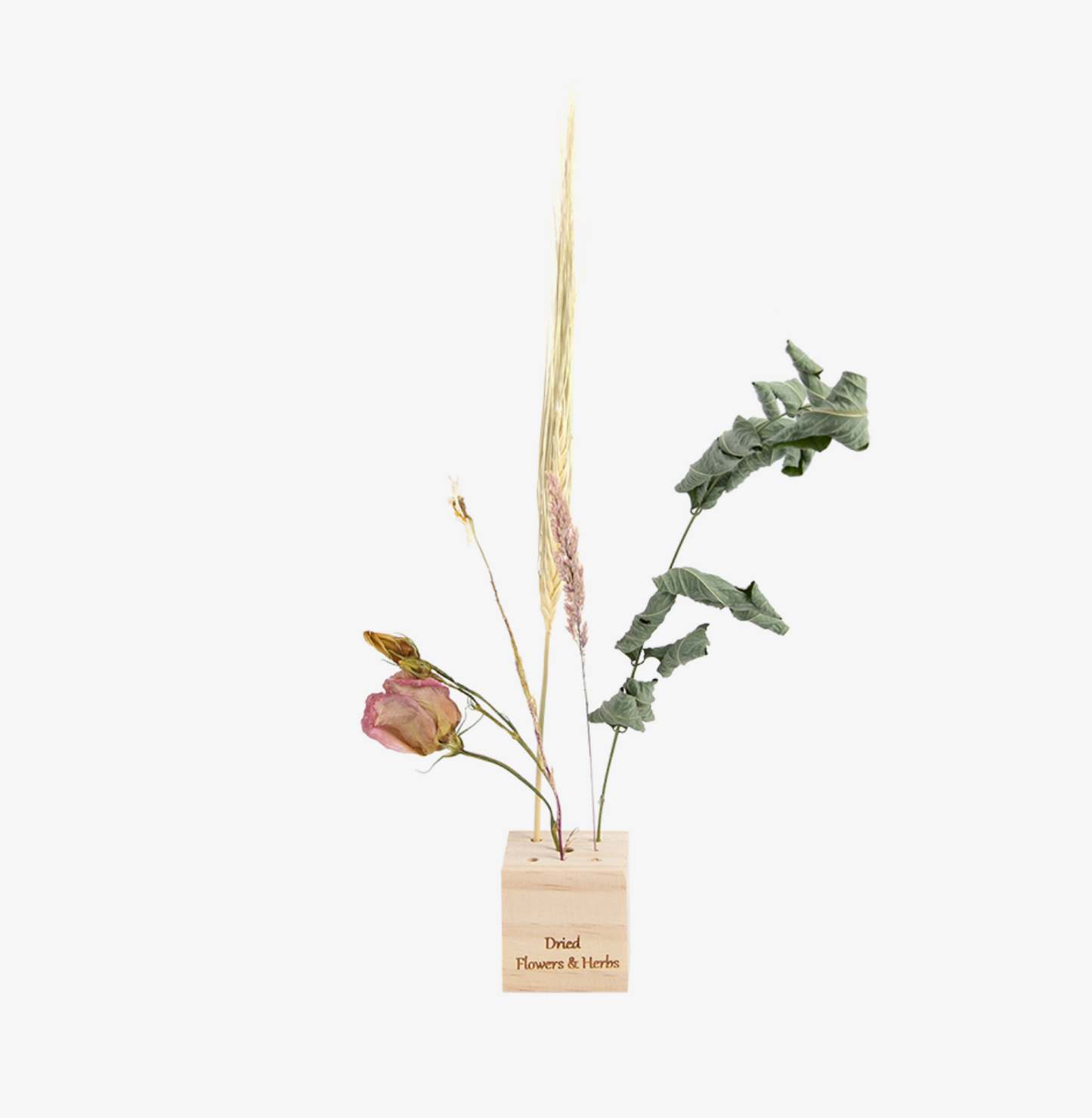 Dried flowers in a wooden holder on a white background