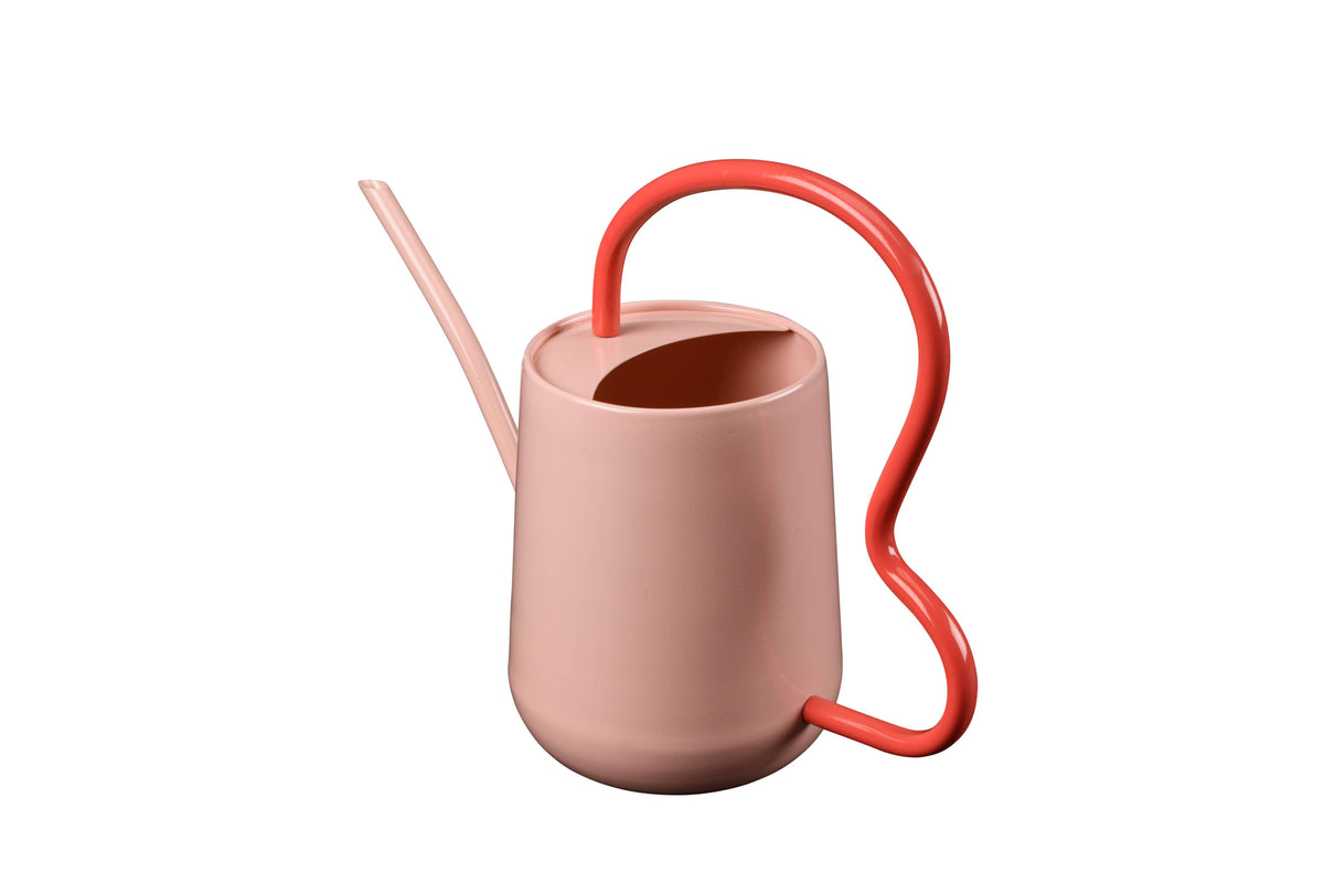 Pink watering can with red handle and spout on a white background
