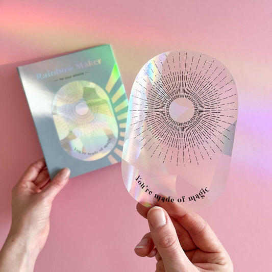 Holographic card with 'Rainbow Maker' design and a pink card with 'You're made of magic' text on a pink background.