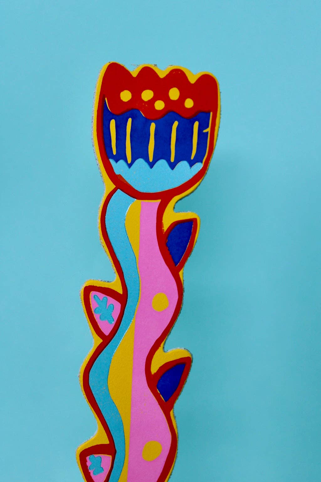 Colorful abstract art piece on a blue background
