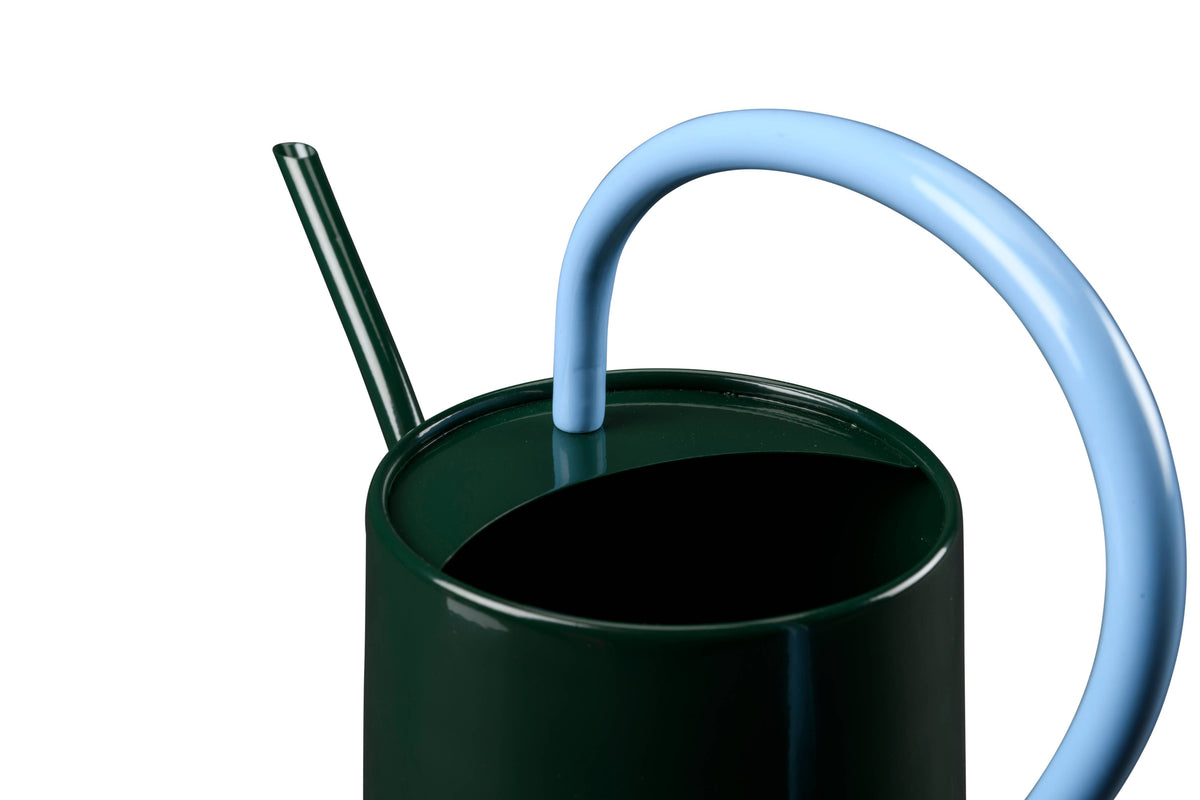Dark green cup with a blue straw on a white background
