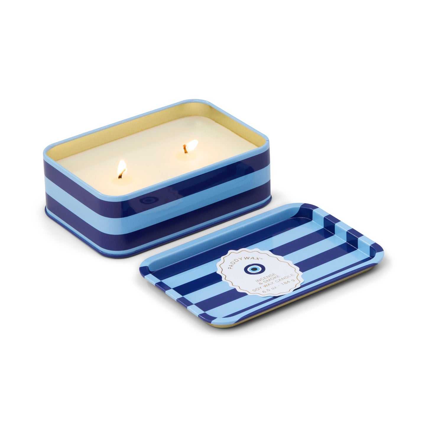 Rectangular striped candle in a blue and white tin with a lid on a white background