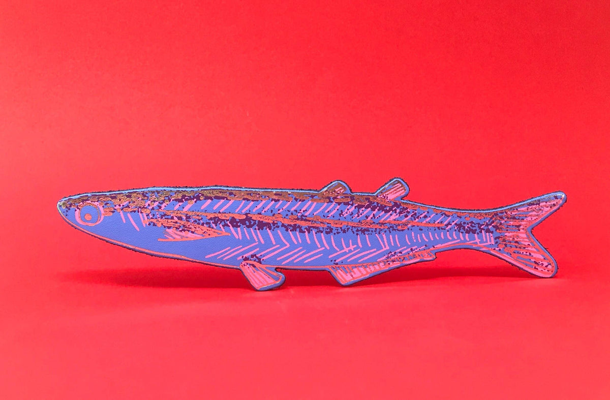 Fish-shaped object on a red background