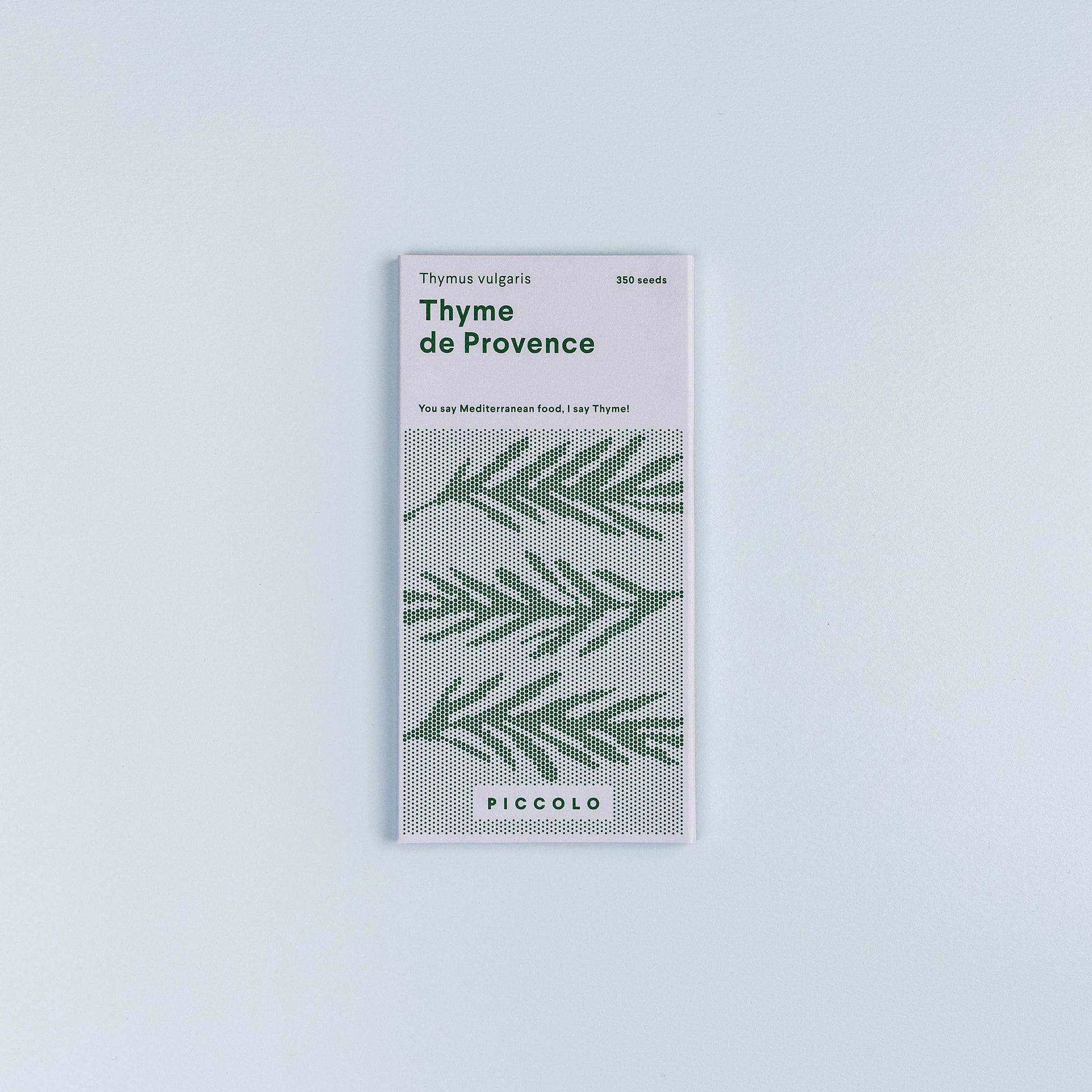 Packaging of Thyme de Provence with green leaf pattern on a light gray background