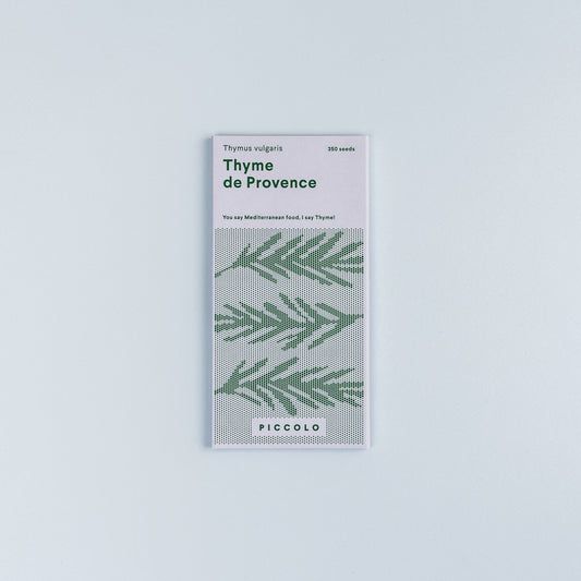 Packaging of Thyme de Provence with green leaf pattern on a light gray background